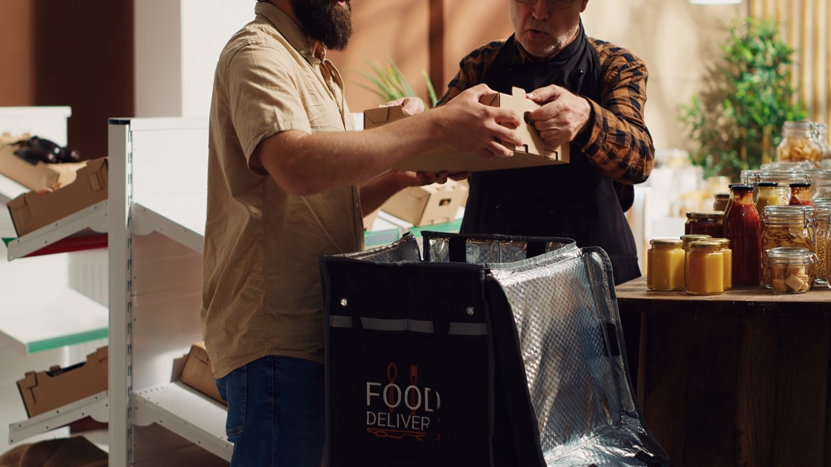 Volunteers preparing Thanksgiving meals for delivery.