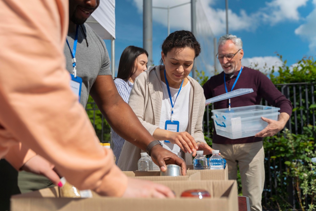 Volunteers gathering at an outdoor appreciation picnic.