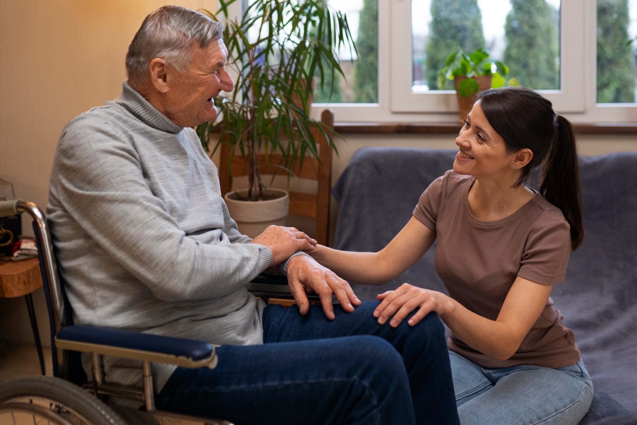 A moment of care between a volunteer and a senior client.