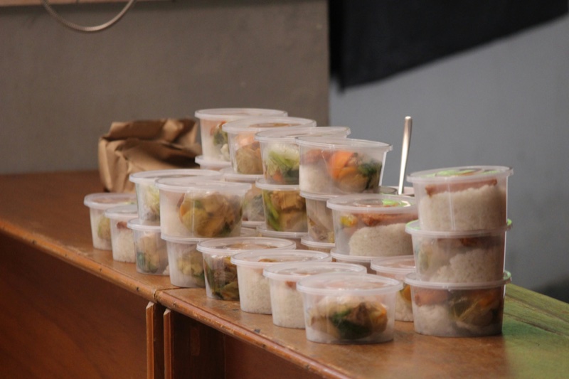 Trays of frozen meals stacked, ready for weekly delivery.