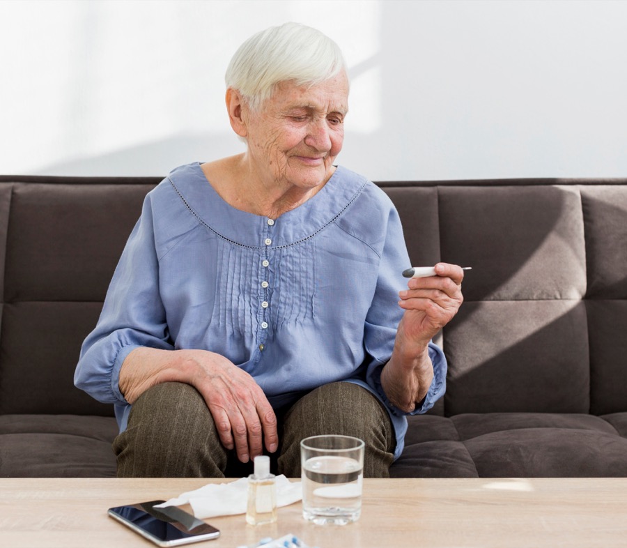A homebound senior woman sitting in her living room